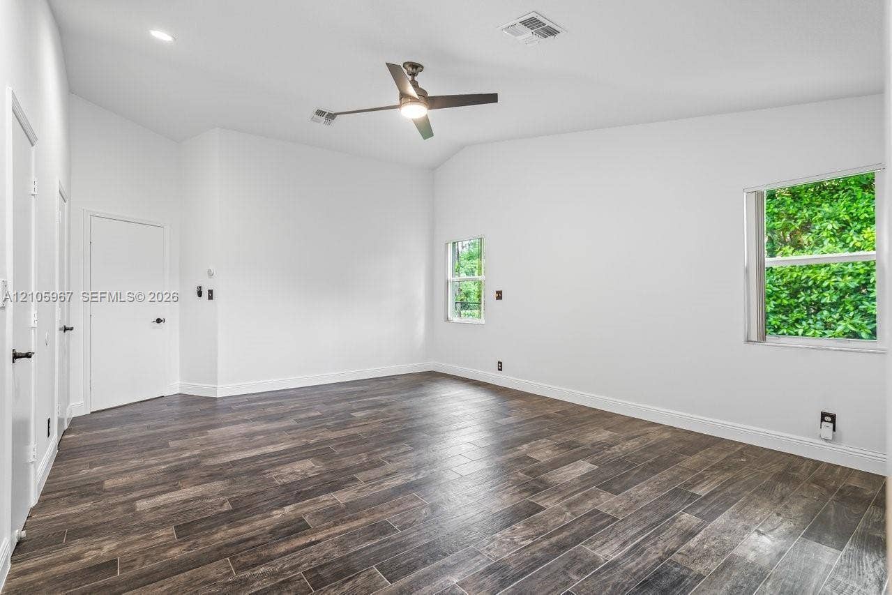 5966 NW 77th Terrace, Parkland, Parkland, FL 33067 Vaulted ceilings, wood-finish flooring, recessed lighting, and a multi-blade ceiling fan
