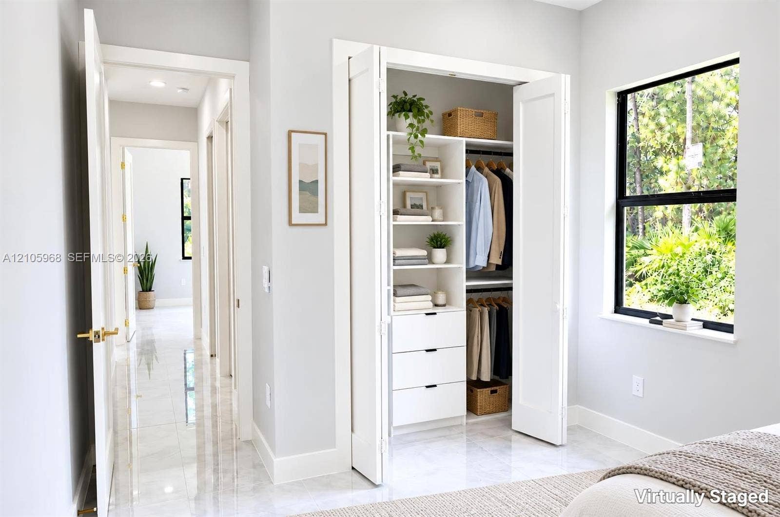 3509 63rd Street W, Lehigh Acres, FL 33971 Built-in closet system with shelving and drawers, floor-to-ceiling bi-fold doors, large window with black frame, and polished tile flooring