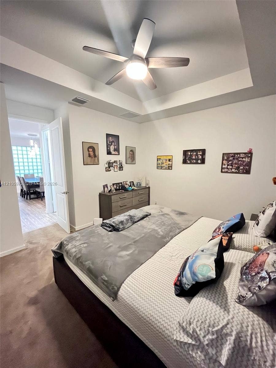 6220 Oceanaire Way, Lake Worth, FL 33467 Tray ceiling with integrated recessed lighting and a central ceiling fan