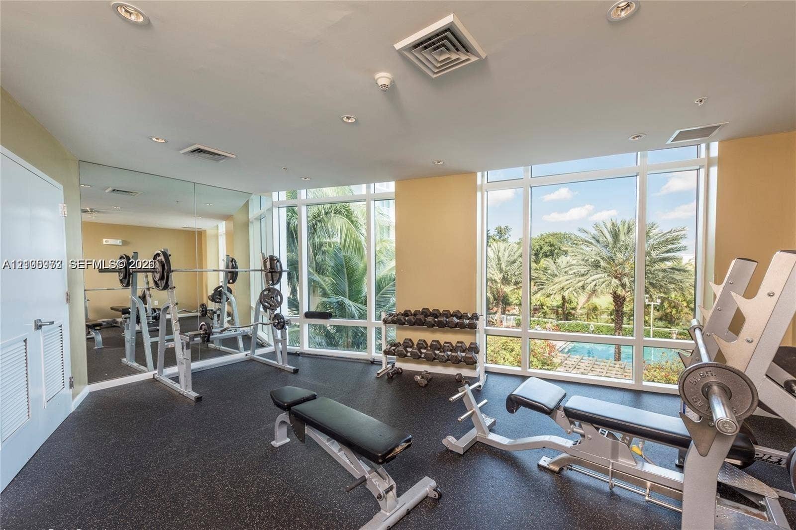 1755 E Hallandale Beach Boulevard, #704E, Hallandale Beach, Hallandale Beach, FL 33009 Fitness center featuring floor-to-ceiling windows, full-wall mirrors, and resilient rubber flooring