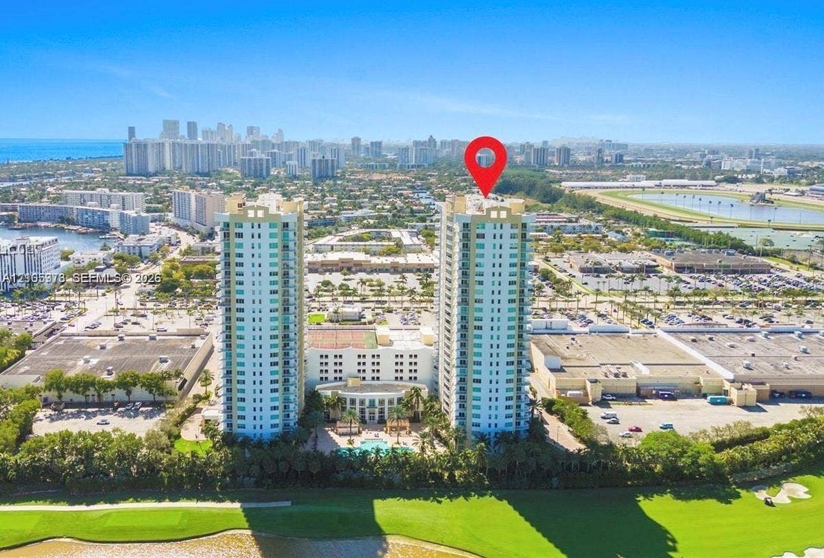1755 E Hallandale Beach Boulevard, #704E, Hallandale Beach, Hallandale Beach, FL 33009 High-rise residential towers featuring glass balconies, a landscaped ground-level swimming pool, and direct access to an expansive golf course