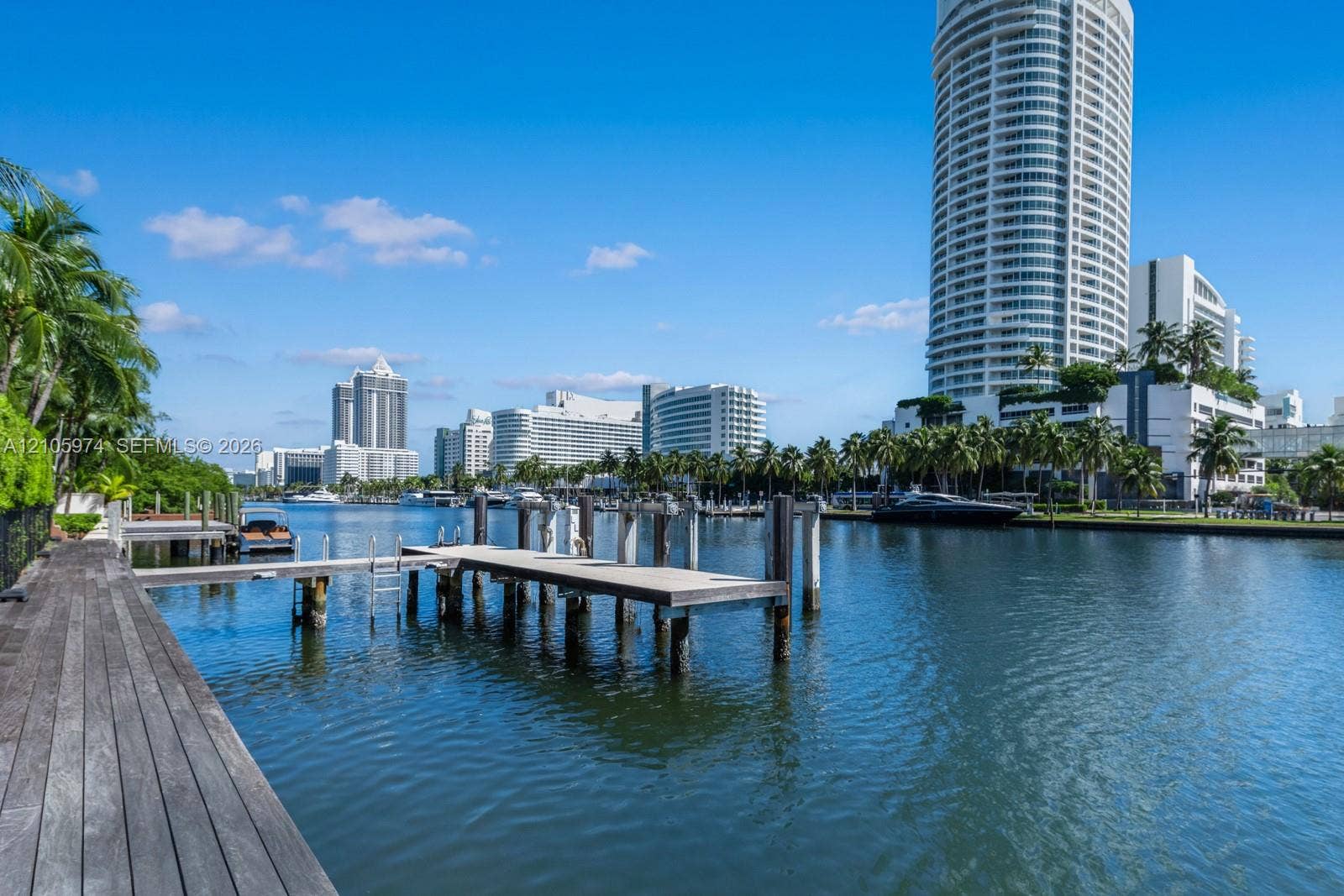 4395 Pine Tree Drive, Miami Beach, FL 33140 Private deep-water dock featuring integrated pylons and wooden decking