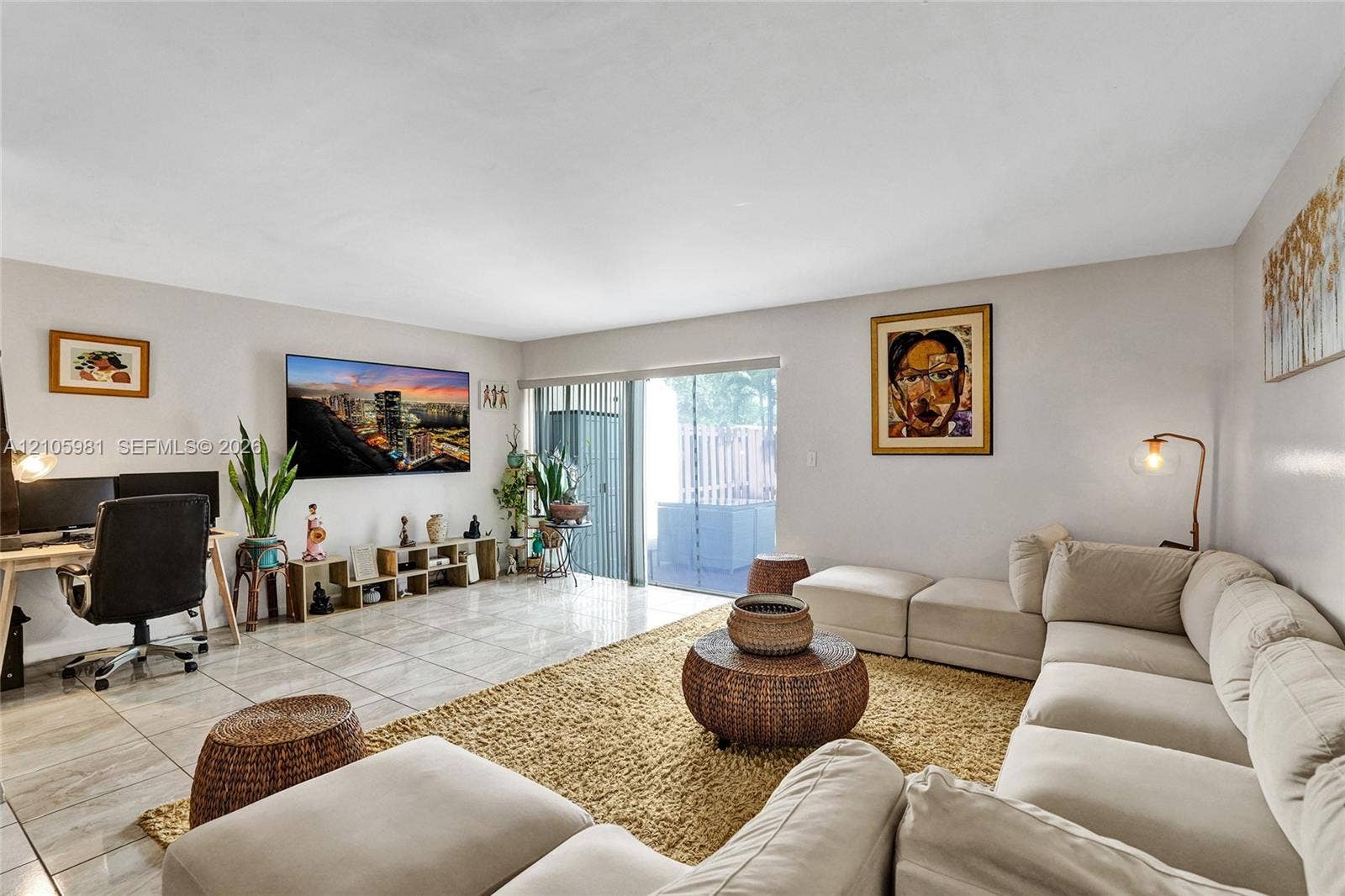 6813 NW 29th Avenue, Fort Lauderdale, Fort Lauderdale, FL 33309 Living area featuring tile flooring and sliding glass doors providing outdoor access