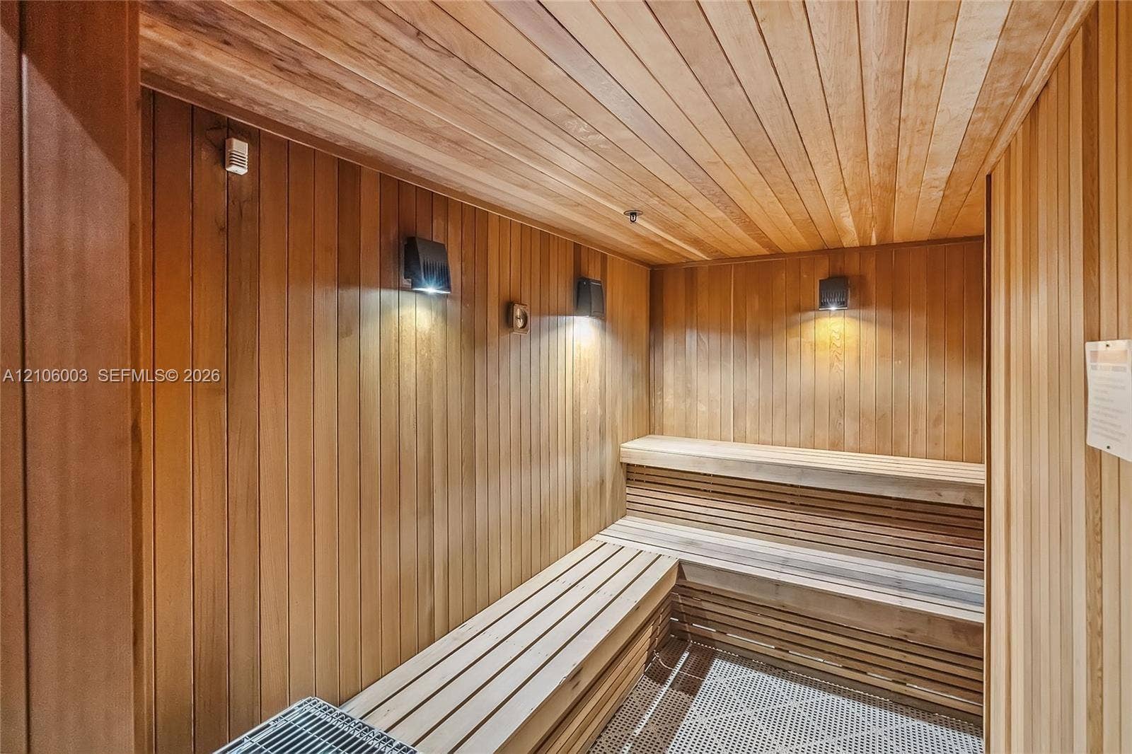 1850 S Ocean Drive, #3309, Hallandale Beach, Hallandale Beach, FL 33009 Sauna featuring tongue-and-groove wood paneling, multi-level built-in bench seating, and wall-mounted lighting