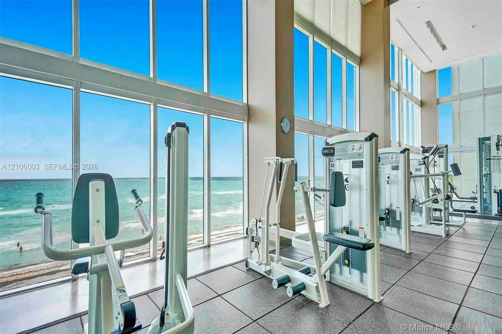 1850 S Ocean Drive, #3309, Hallandale Beach, Hallandale Beach, FL 33009 Fitness center featuring floor-to-ceiling windows, high ceilings, ocean scenery, and industrial-grade rubber flooring