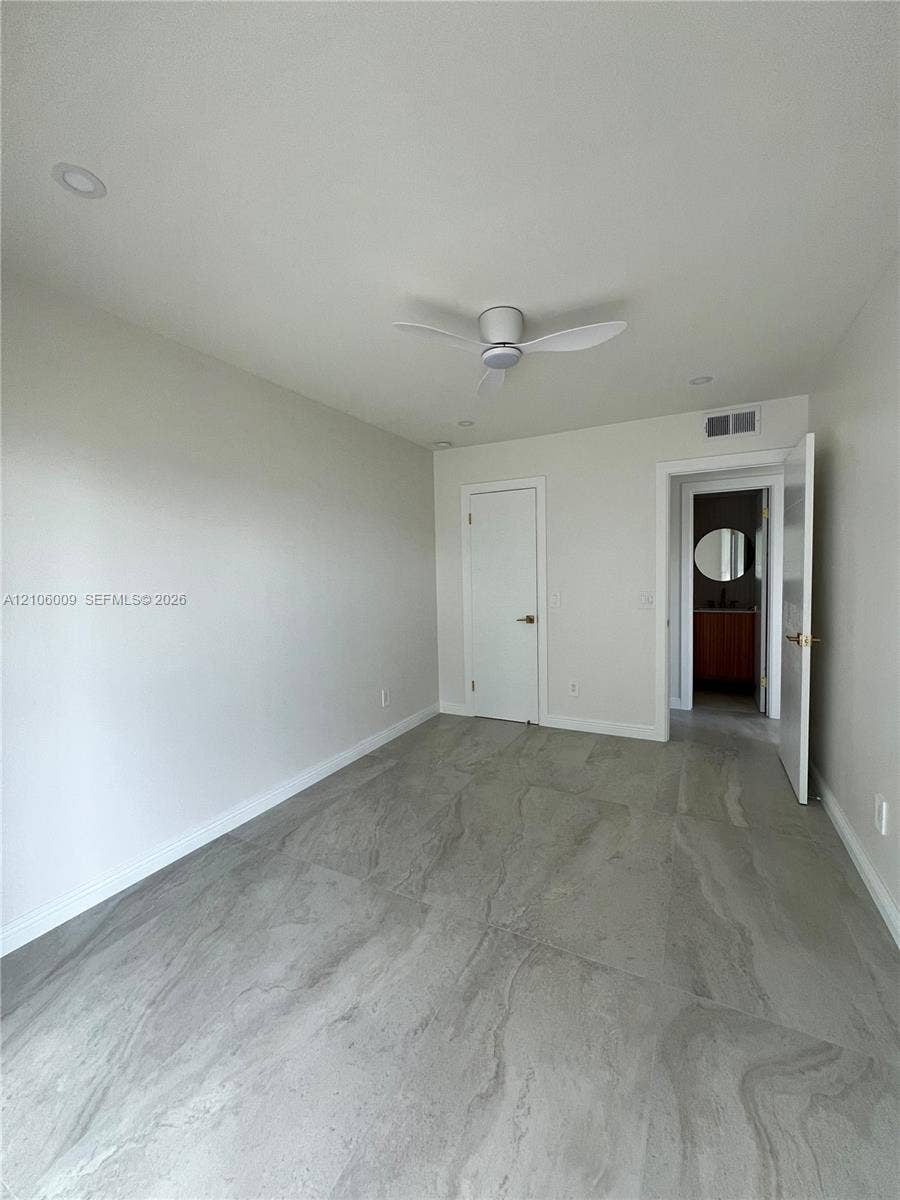 495 Fanshaw L, Boca Raton, FL 33434 Interior space featuring large-format stone-look tile flooring, recessed lighting, and a modern ceiling fan