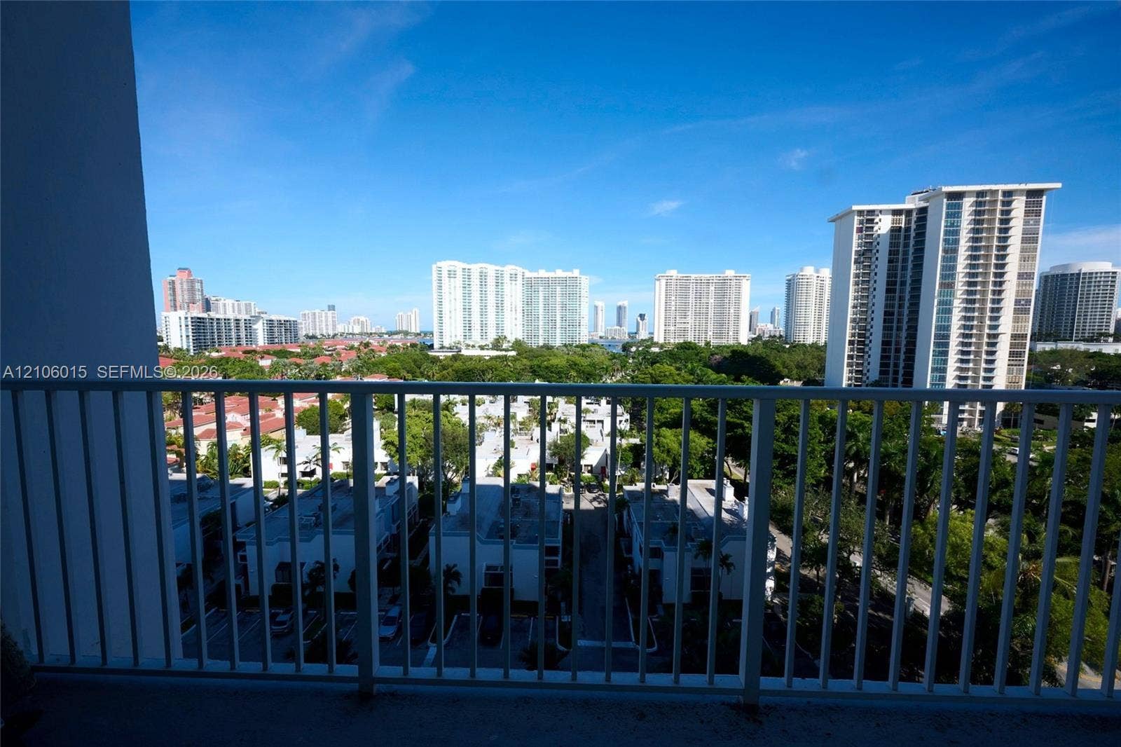 2851 NE 183rd Street, #1109E, Aventura, FL 33160 Private balcony featuring vertical metal railings and a cityscape backdrop