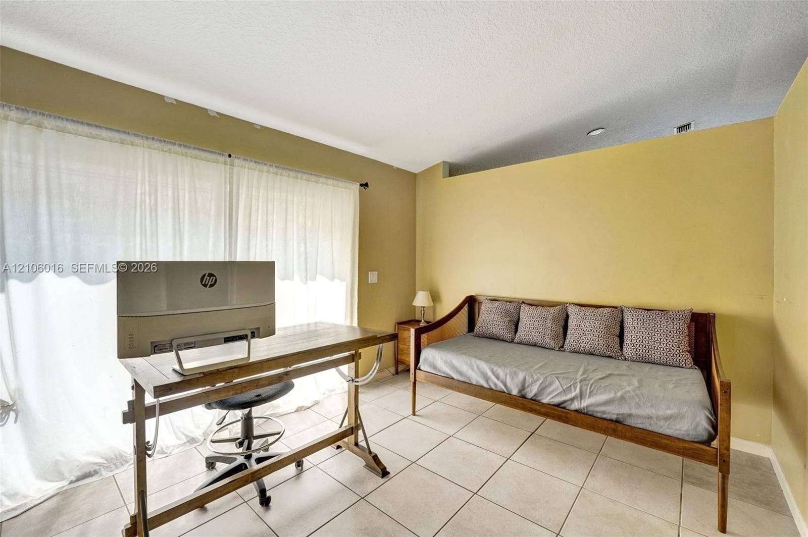 631 NW 135th Terrace, Plantation, FL 33325 Interior space featuring tile flooring, neutral wall paint, and a sliding glass door
