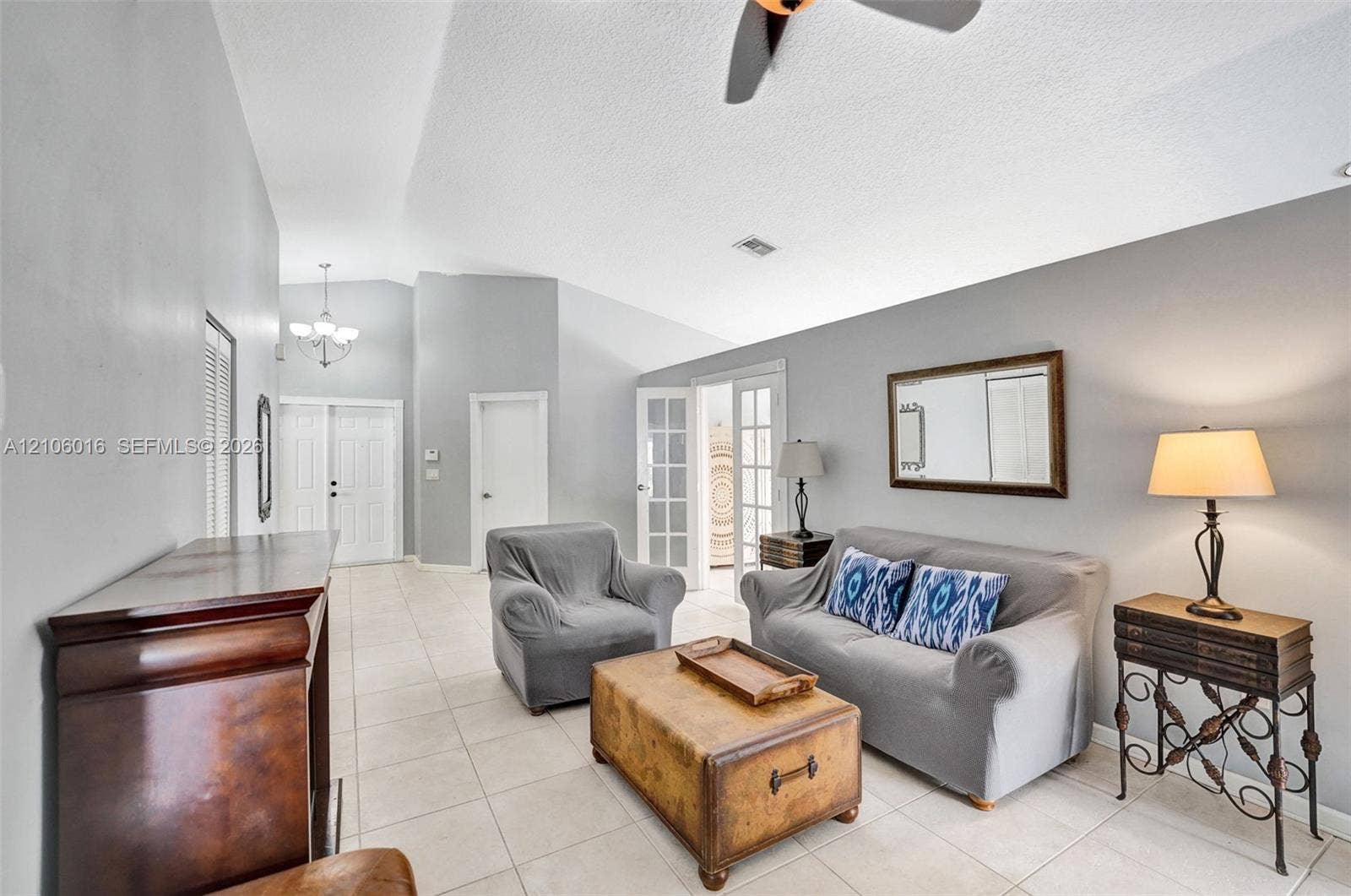 631 NW 135th Terrace, Plantation, FL 33325 Vaulted ceilings, ceramic tile flooring, French doors with glass panes, and double entry doors