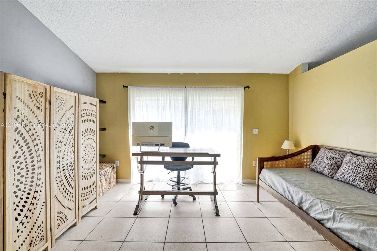 631 NW 135th Terrace, Plantation, FL 33325 Spacious room featuring neutral ceramic tile flooring and sliding glass doors with overhead curtain rod hardware