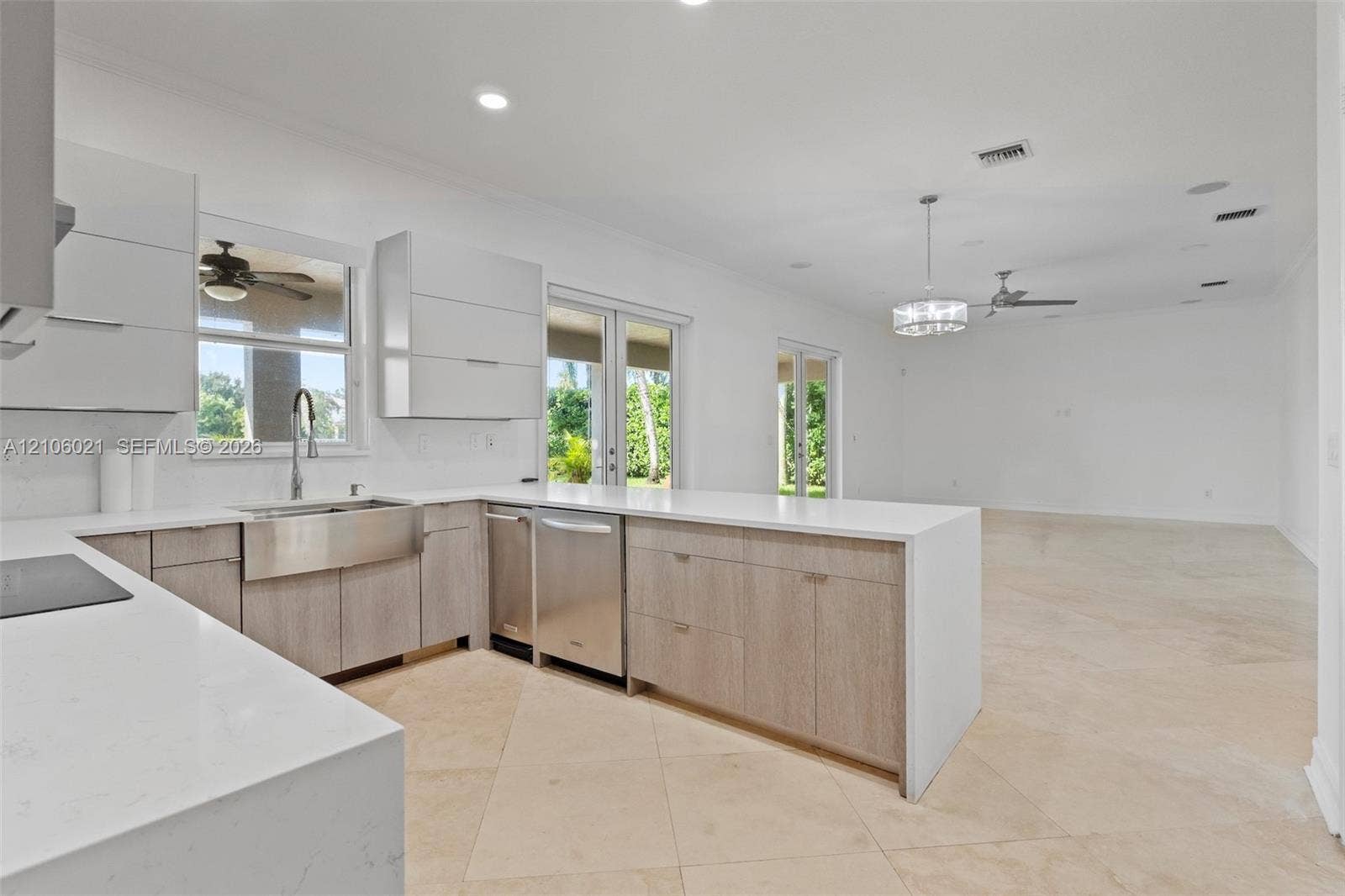 19510 S Coquina Way, Weston, FL 33332 Kitchen featuring light-finish wood cabinetry, white stone countertops, stainless steel farmhouse sink, stainless steel dishwasher, and stone tile flooring