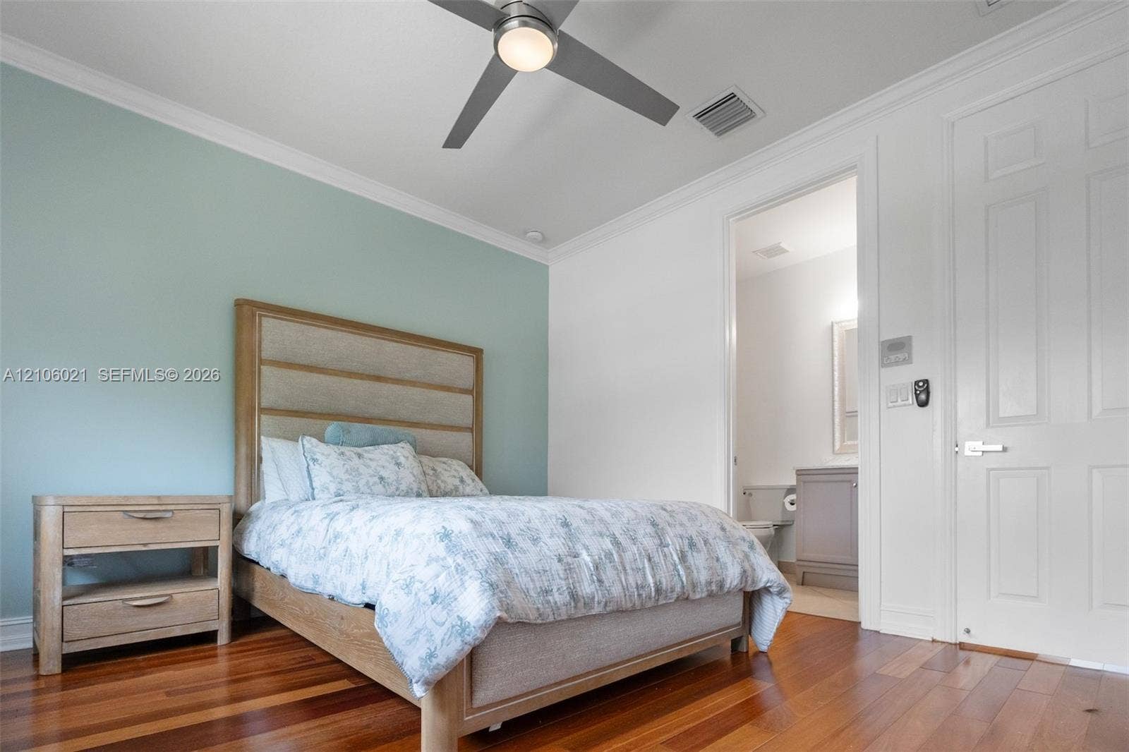 19510 S Coquina Way, Weston, FL 33332 Wood-finish flooring, crown molding, and brushed nickel ceiling fan with integrated lighting
