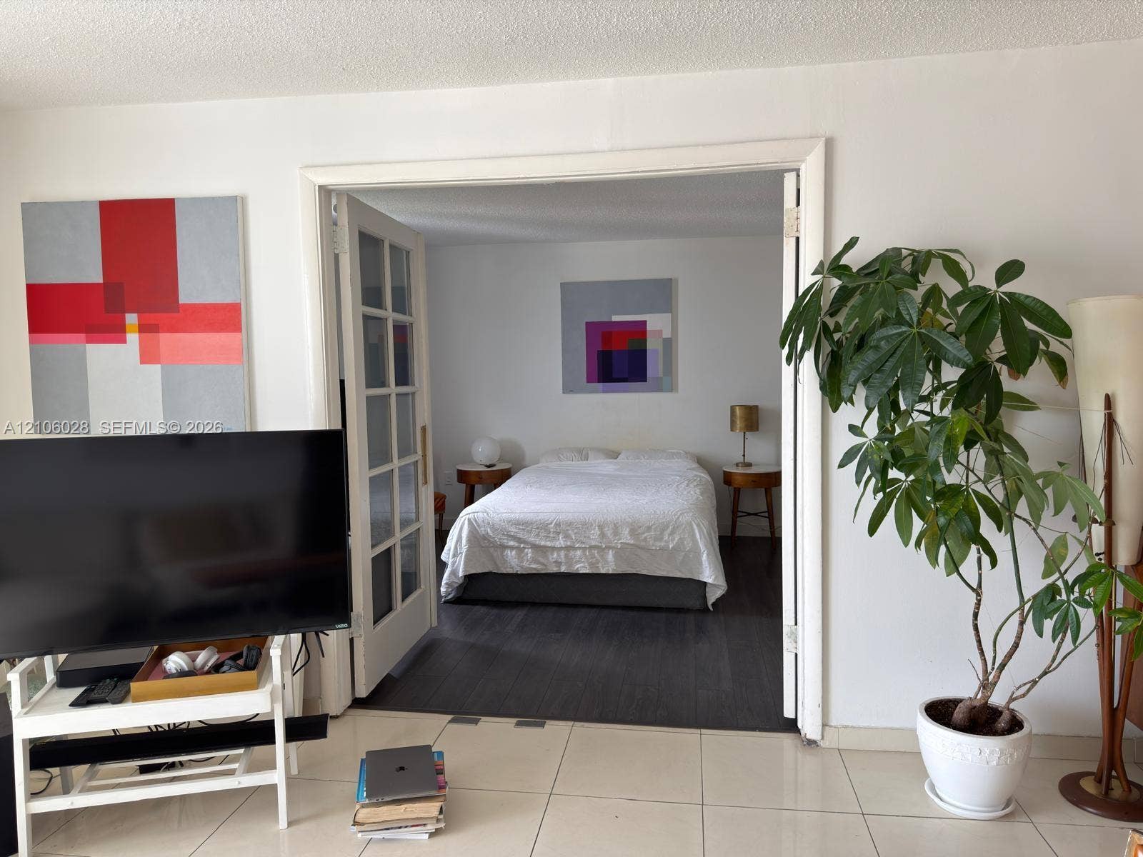 2780 NE 183rd Street, #1605, Aventura, FL 33160 French-style double doors with glass paneling, tile flooring, and dark wood-finish flooring