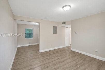 1471 NW 22nd Court, #2, Fort Lauderdale, Fort Lauderdale, FL 33311 Neutral interior featuring wood-finish flooring, recessed ceiling lighting, and a window with exterior exposure