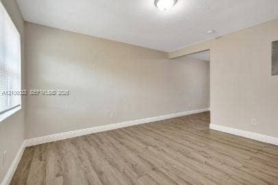 1471 NW 22nd Court, #2, Fort Lauderdale, Fort Lauderdale, FL 33311 Interior space featuring wood-finish flooring, neutral wall paint, and a white ceiling-mounted flush light fixture