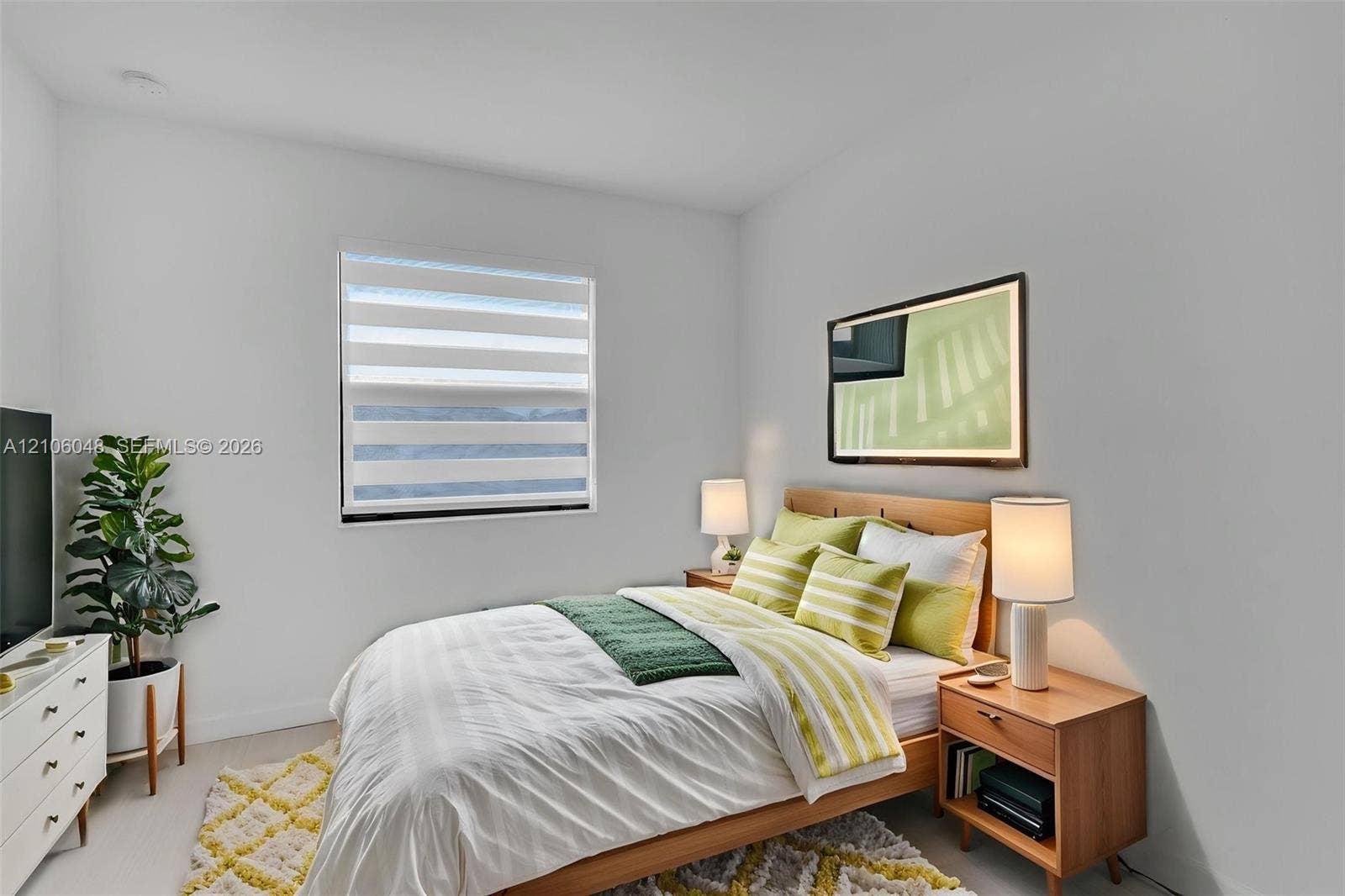 25134 SW 108th Court, Homestead, FL 33032 Neutral interior featuring light-toned flooring, smooth walls, and a window equipped with dual-layered banded shades