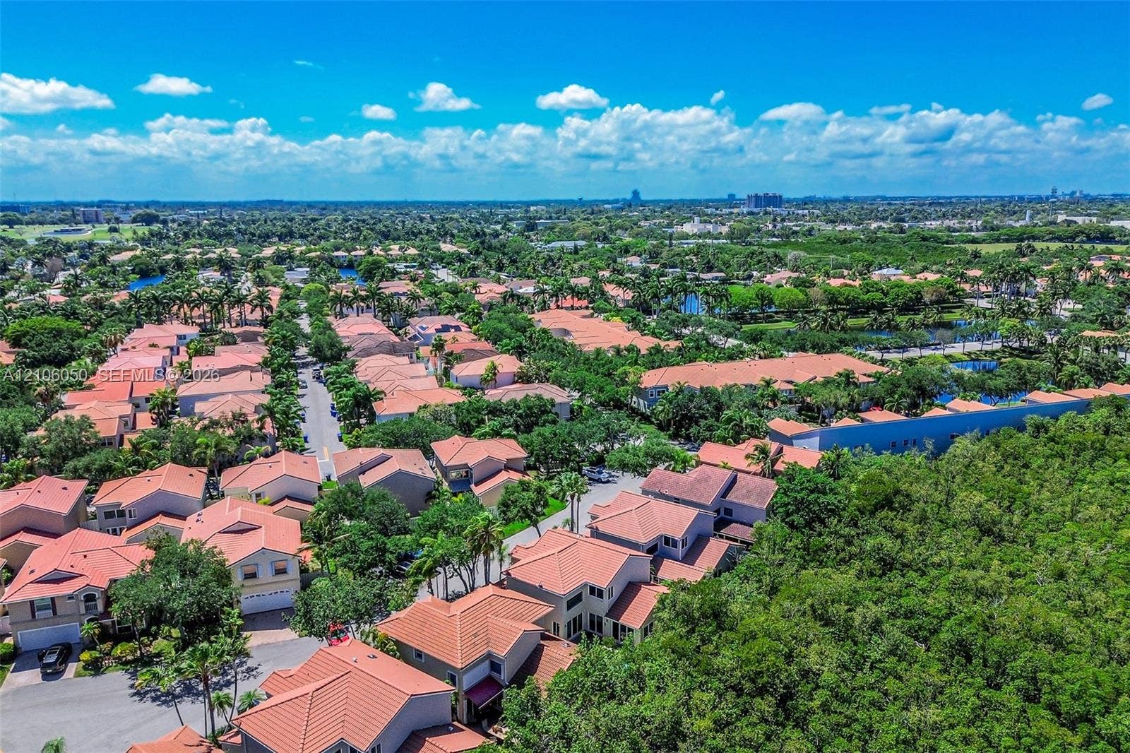 1065 Weeping Willow Way, #0, Hollywood, Hollywood, FL 33019 Aerial perspective featuring residential tile roofing, mature canopy trees, and established landscaped grounds