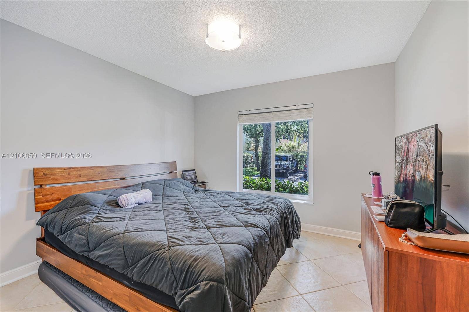 1065 Weeping Willow Way, #0, Hollywood, Hollywood, FL 33019 Neutral-toned walls, tile flooring, flush-mount ceiling lighting, and a window with a horizontal blind