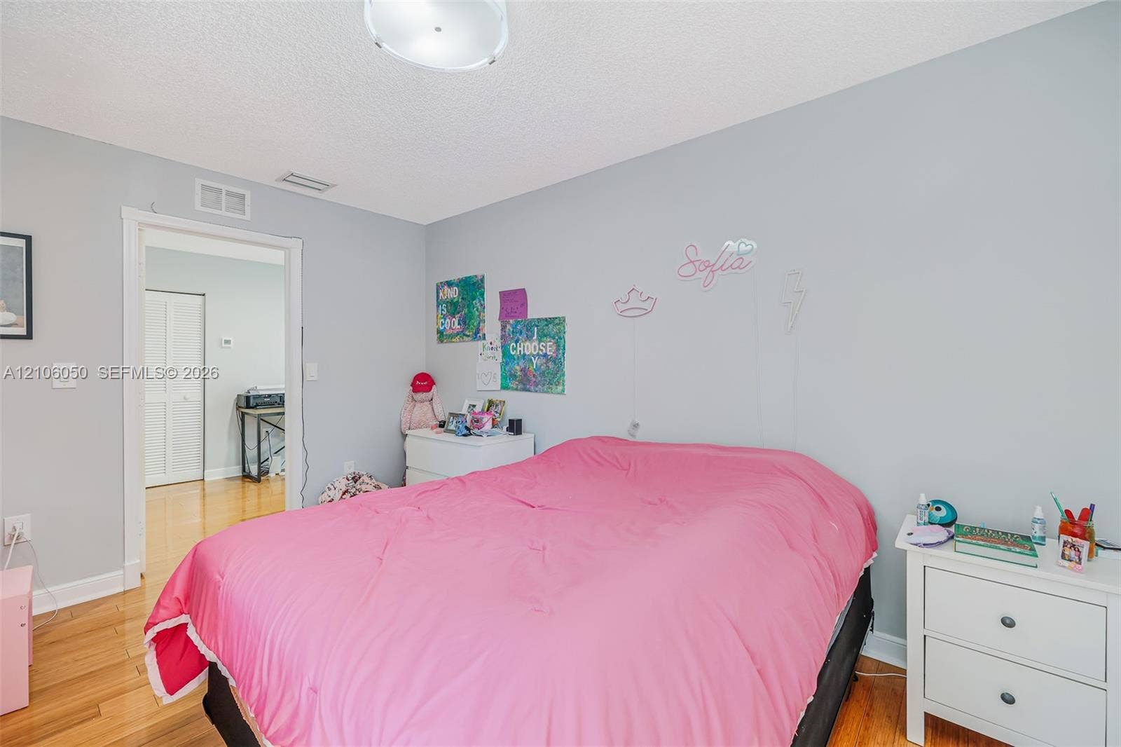 1065 Weeping Willow Way, #0, Hollywood, Hollywood, FL 33019 Room featuring wood-finish flooring, a neutral-toned wall finish, and a ceiling-mounted light fixture