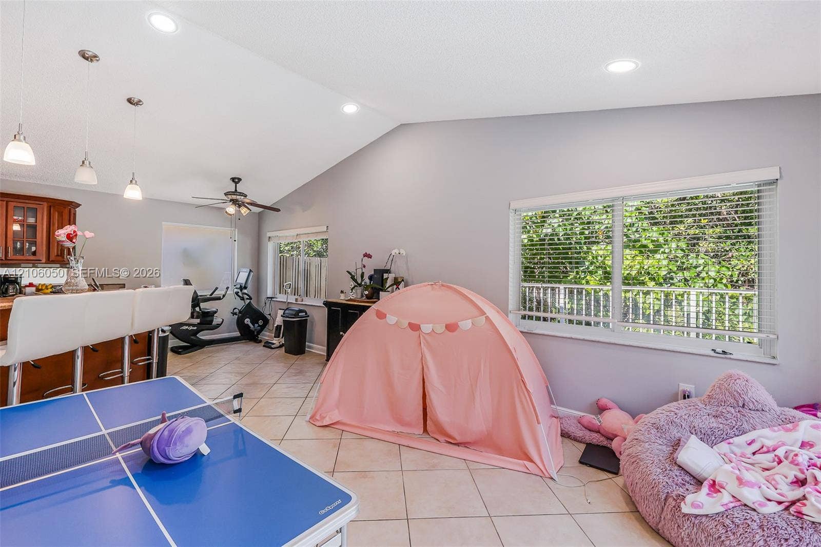1065 Weeping Willow Way, #0, Hollywood, Hollywood, FL 33019 Vaulted ceilings, tile flooring, recessed lighting, pendant lighting, and horizontal window blinds
