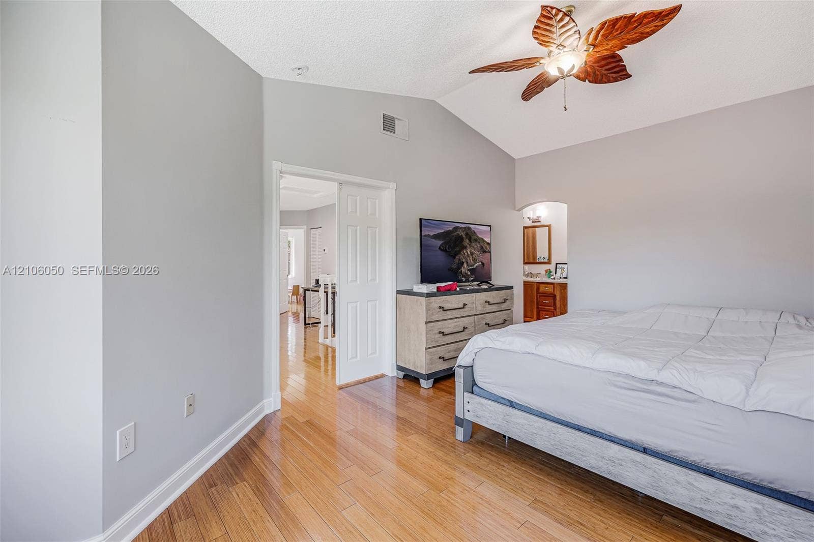 1065 Weeping Willow Way, #0, Hollywood, Hollywood, FL 33019 Vaulted ceilings, wood-finish flooring, and a decorative leaf-style ceiling fan