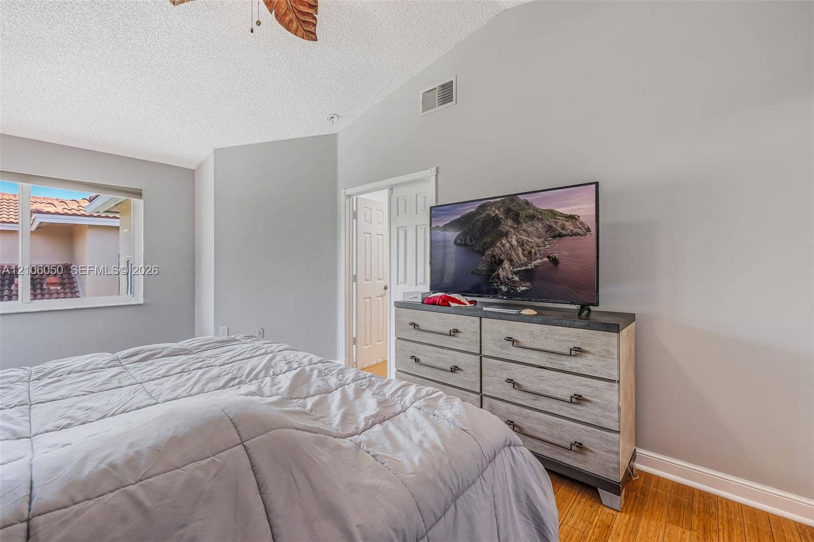 1065 Weeping Willow Way, #0, Hollywood, Hollywood, FL 33019 Vaulted ceilings, wood-finish flooring, and white interior doors