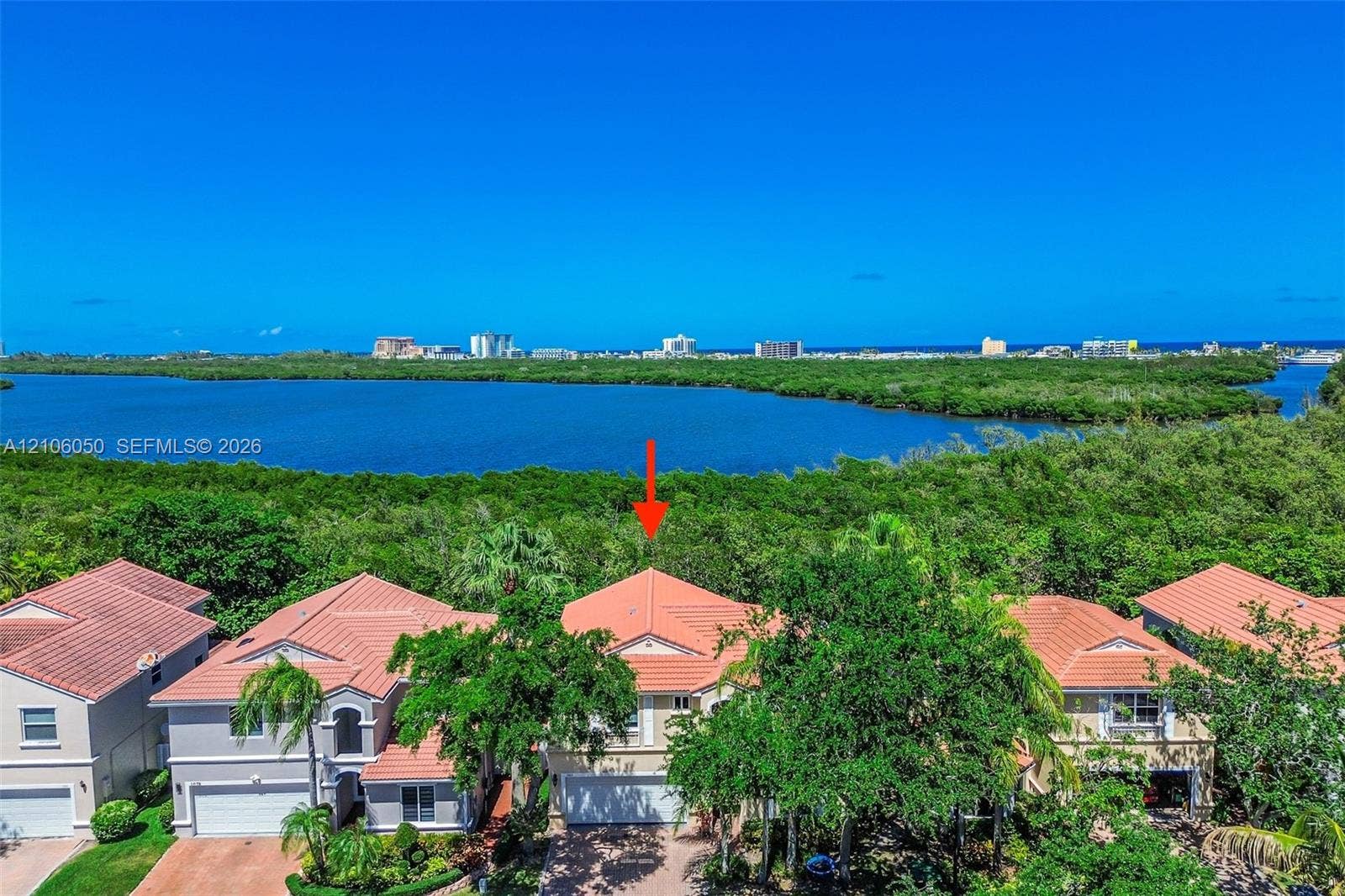1065 Weeping Willow Way, #0, Hollywood, Hollywood, FL 33019 Aerial perspective showcasing this waterfront residence nestled within a lush, mature landscape