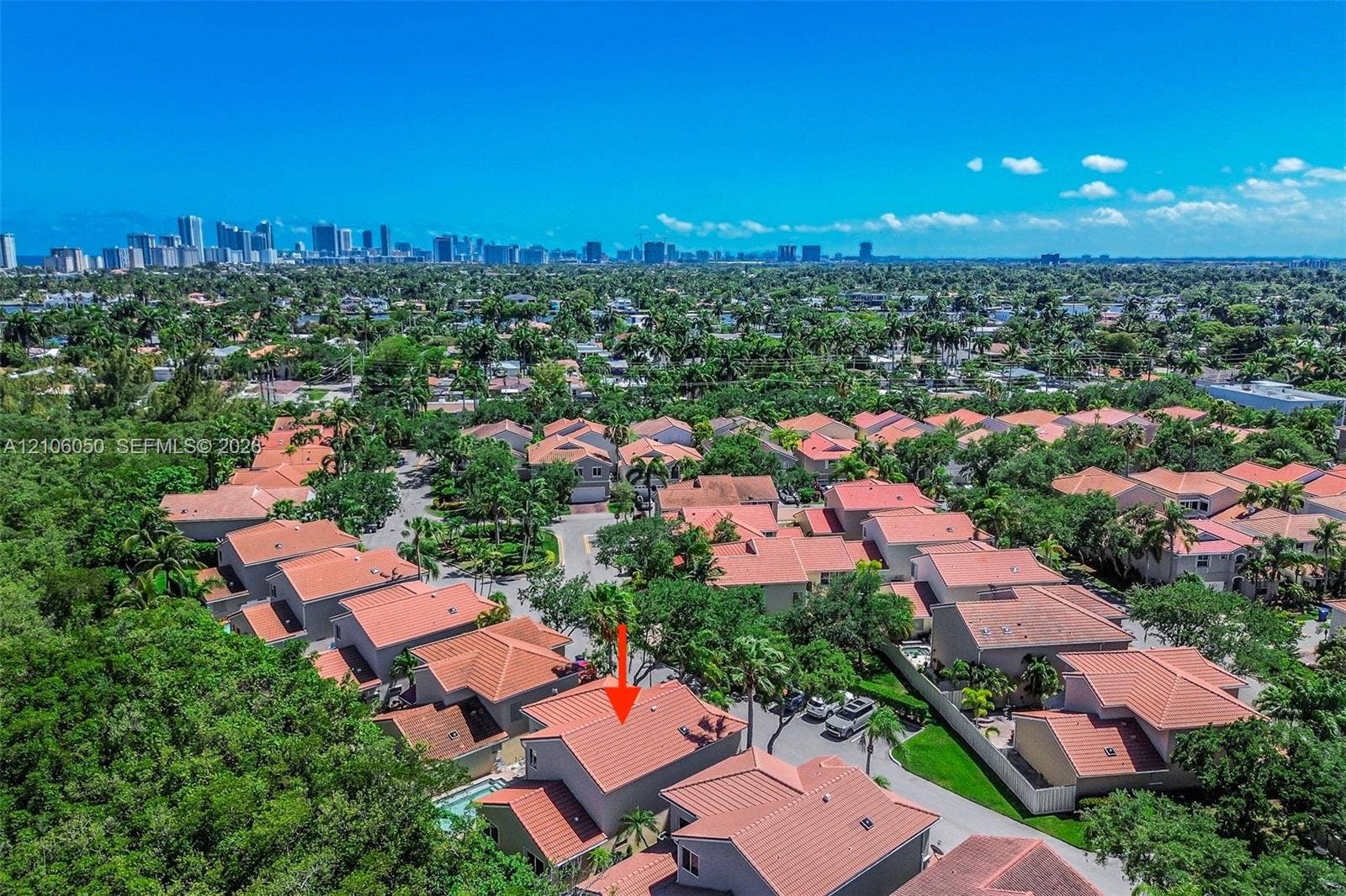 1065 Weeping Willow Way, #0, Hollywood, Hollywood, FL 33019 Aerial perspective of a multi-story residence featuring a terracotta tile roof and an in-ground swimming pool, situated within a suburban residential community