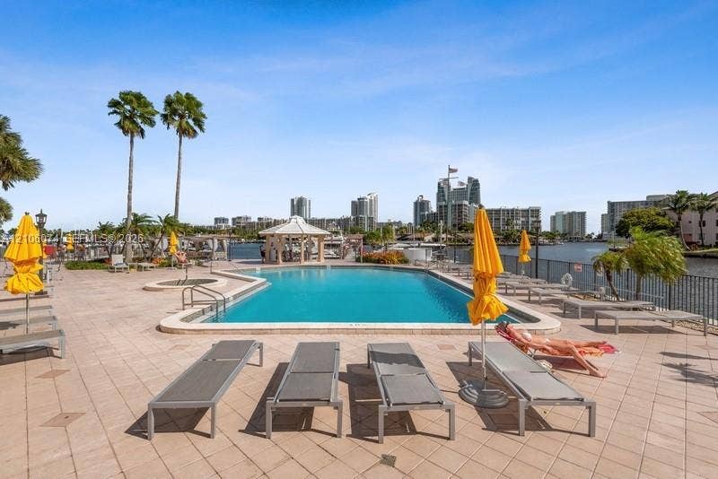 300 Three Islands Boulevard, #308, Hallandale Beach, Hallandale Beach, FL 33009 Waterfront swimming pool with tiled decking, integrated spa, and permanent gazebo structure