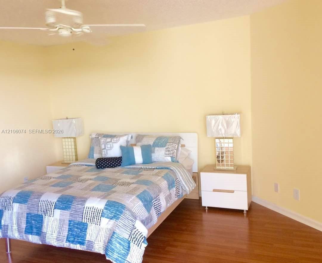 300 Three Islands Boulevard, #308, Hallandale Beach, Hallandale Beach, FL 33009 Room interior featuring wood-finish flooring and a ceiling-mounted fan with integrated lighting