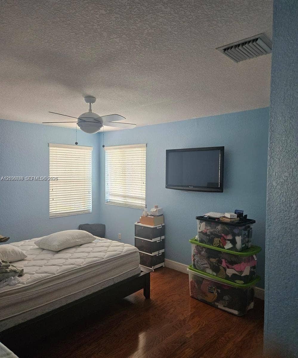 13382 Lakepointe Circle, #0, Cooper City, Cooper City, FL 33330 Wood-finish flooring, ceiling fan with integrated lighting, and dual windows with fitted blinds