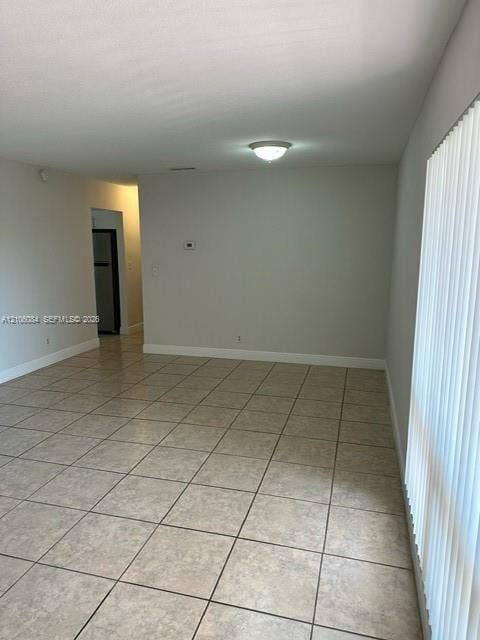 324 SE 10th Avenue, #1-8, Pompano Beach, Pompano Beach, FL 33060 Neutral-toned interior space featuring tile flooring and a ceiling-mounted light fixture