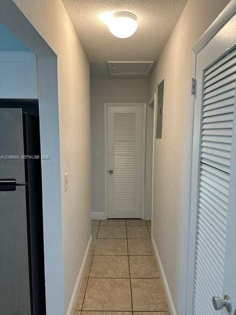 324 SE 10th Avenue, #1-8, Pompano Beach, Pompano Beach, FL 33060 Room featuring tile flooring, neutral wall paint, two windows with blinds, and a ceiling fan