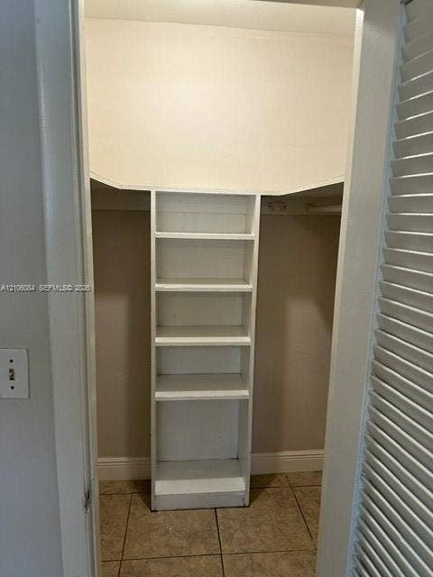 324 SE 10th Avenue, #1-8, Pompano Beach, Pompano Beach, FL 33060 Ceramic tile flooring, ceiling fan with integrated lighting, and louvered closet door