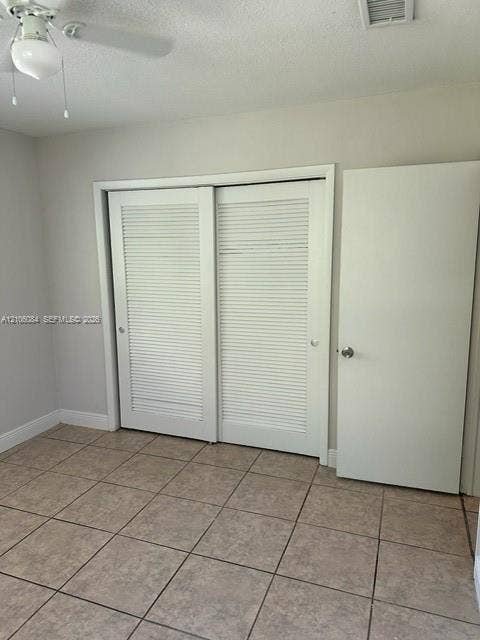 324 SE 10th Avenue, #1-8, Pompano Beach, Pompano Beach, FL 33060 Bathroom featuring a shower and tub combination with wall-surround tiling, a vanity with a dark countertop and white cabinetry, and tile flooring