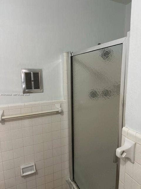 324 SE 10th Avenue, #1-8, Pompano Beach, Pompano Beach, FL 33060 Open floor plan featuring neutral tile flooring, light grey walls, and ceiling-mounted dome lighting, complete with vertical window blinds