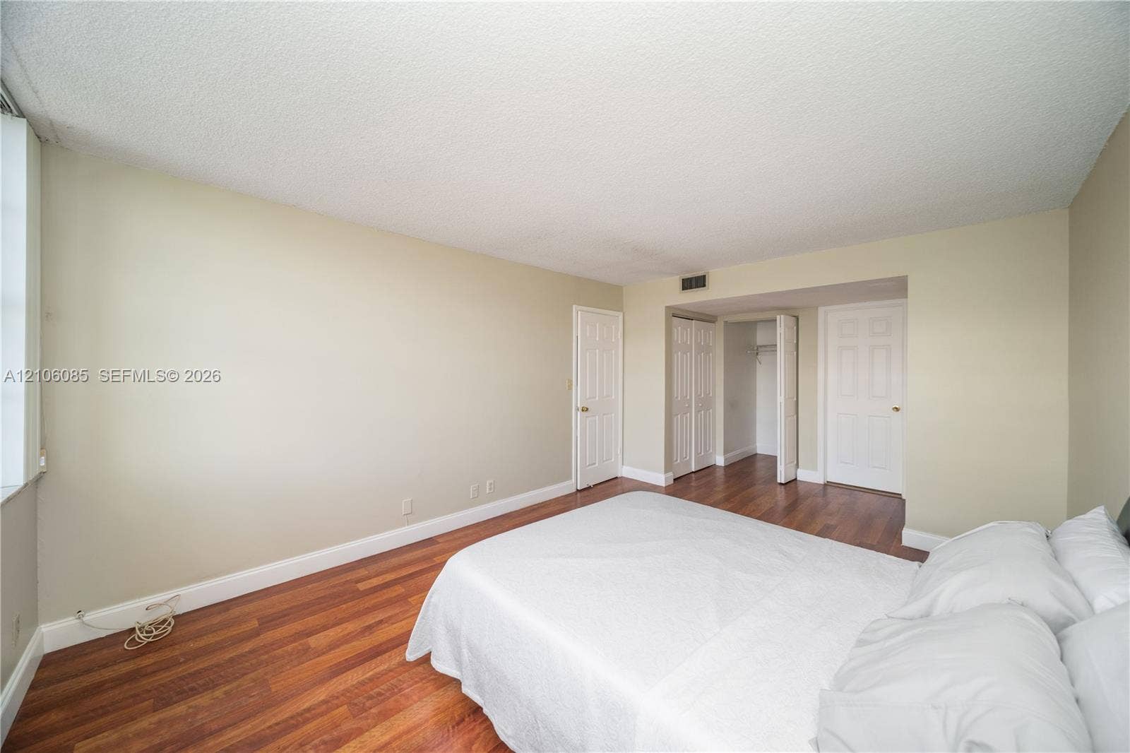 16710 NE 9th Avenue, #705, North Miami Beach, North Miami Beach, FL 33162 Wood-finish flooring, six-panel interior doors, and built-in closet storage