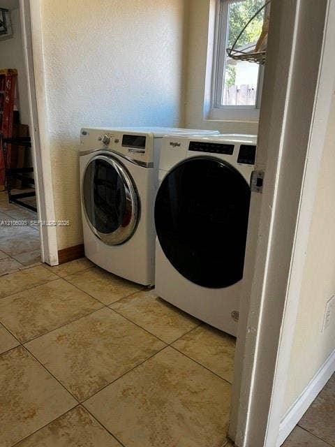 1325 N 74th Terrace, #0, Hollywood, Hollywood, FL 33024 Laundry space featuring large-format stone-finish floor tiling and a single-pane window