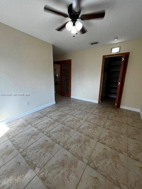 1325 N 74th Terrace, #0, Hollywood, Hollywood, FL 33024 Ceramic tile flooring, ceiling fan with integrated multi-light fixture, and natural wood-finish door frames