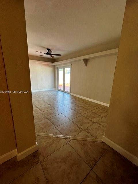 1325 N 74th Terrace, #0, Hollywood, Hollywood, FL 33024 Large-format tile flooring, double glass-panel doors, and ceiling-mounted fan