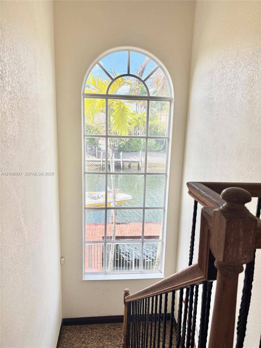 1141 Waterside Lane, Hollywood, FL 33019 Huge window by staircase overlooking the water.