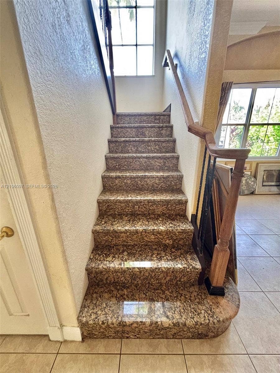 1141 Waterside Lane, Hollywood, FL 33019 Granite staircase leading to the 2nd floor