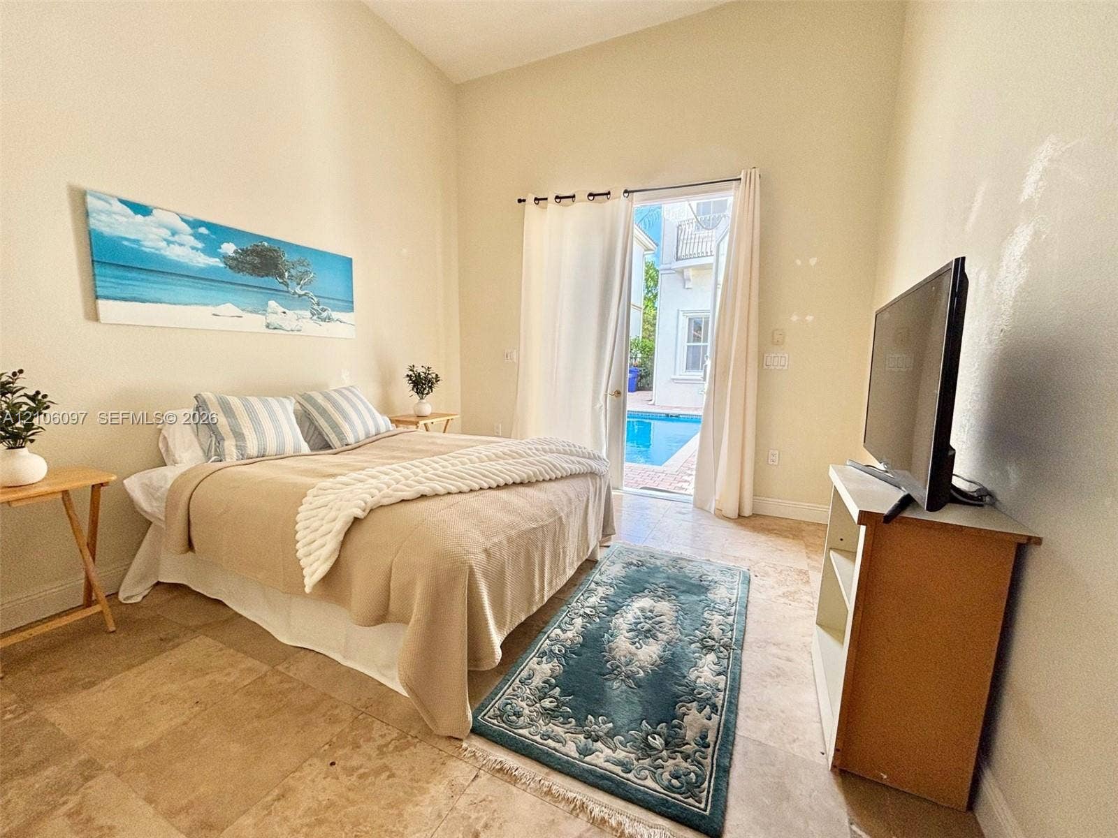 1141 Waterside Lane, Hollywood, FL 33019 Guest house bedroom overlooking the pool.
