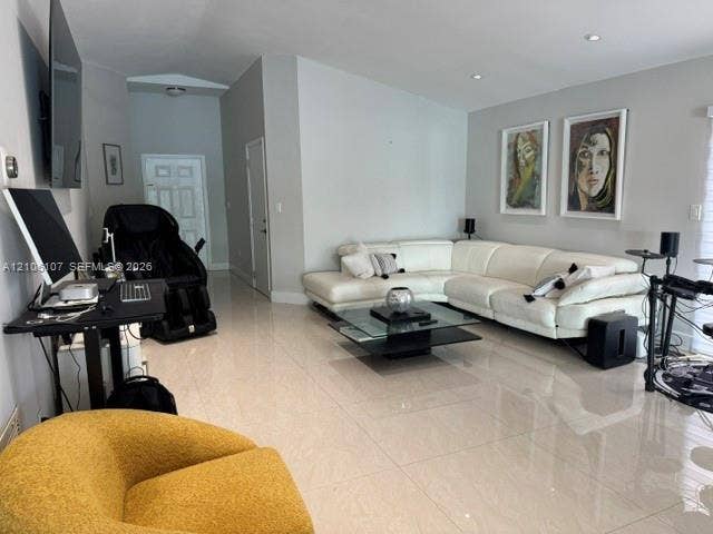 16284 SW 100th Terrace, Miami, FL 33196 Open-concept living space featuring high ceilings, polished tile flooring, and recessed lighting