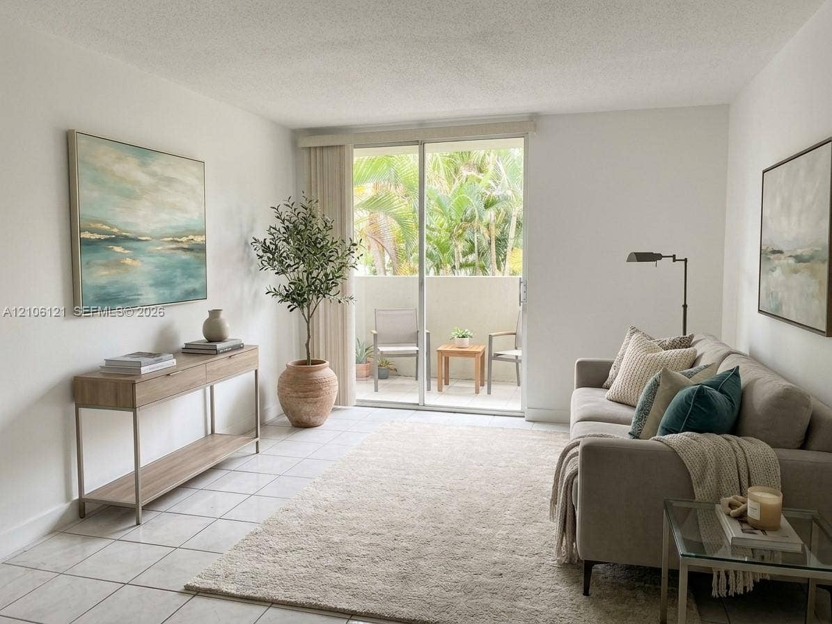 Neutral tile flooring, sliding glass door, and private balcony