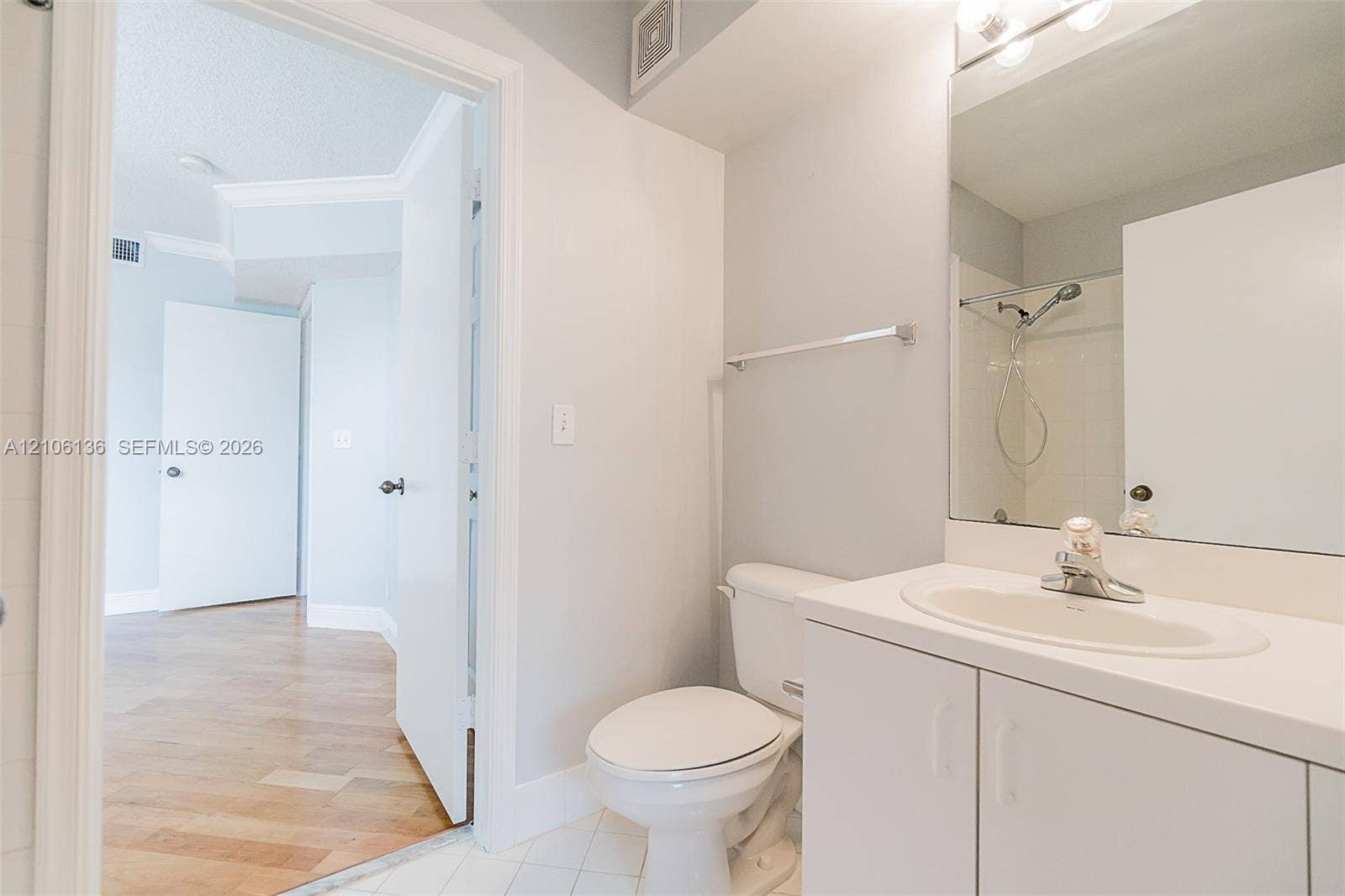 3713 San Simeon Circle, Weston, Weston, FL 33331 Bathroom featuring a white vanity cabinet, solid-surface countertop with an integrated oval sink, full-width wall mirror, and a shower-tub combination with a handheld shower fixture