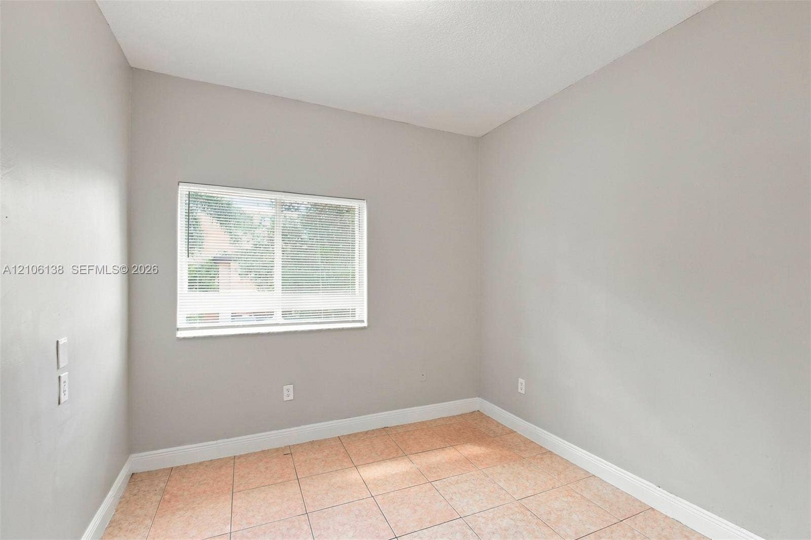 16119 SW 61st Lane, Miami, Miami, FL 33193 Neutral-toned interior walls, ceramic tile flooring, and horizontal sliding window