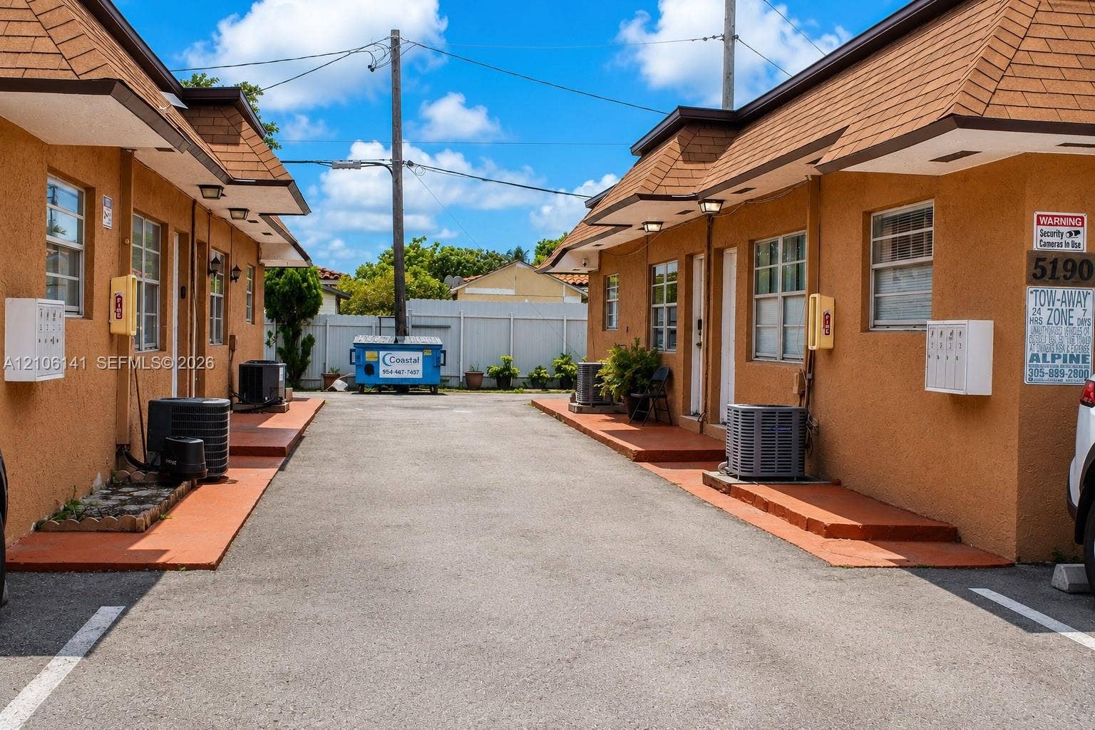 5190 E 10th Avenue, #1, Hialeah, Hialeah, FL 33013 Exterior facade featuring stucco siding, mansard-style rooflines, individual entry landings, and exterior-mounted wall mailboxes