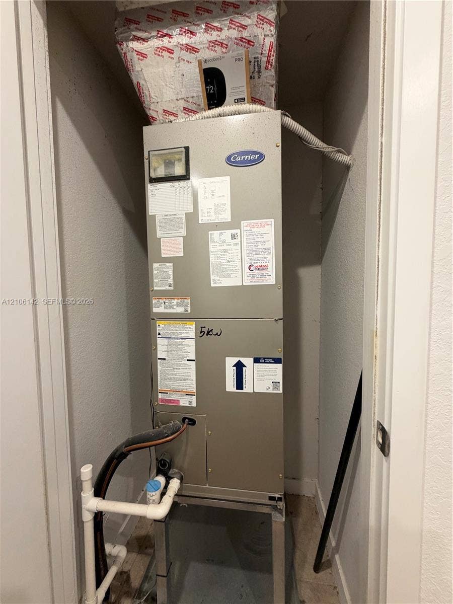 Carrier heating and cooling air handler unit housed within a dedicated utility closet