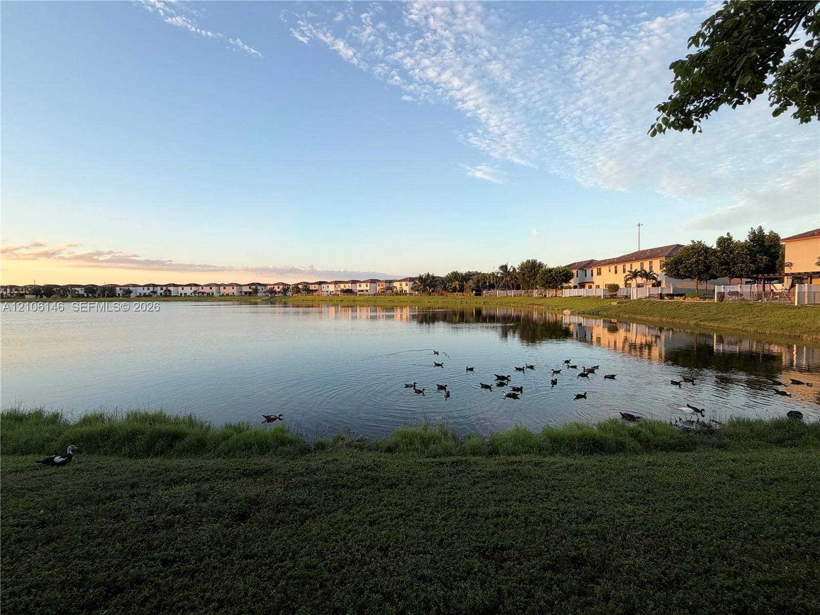 3259 W 100th Terrace, Hialeah, FL 33018 Waterfront lot featuring a large lake and expansive green space